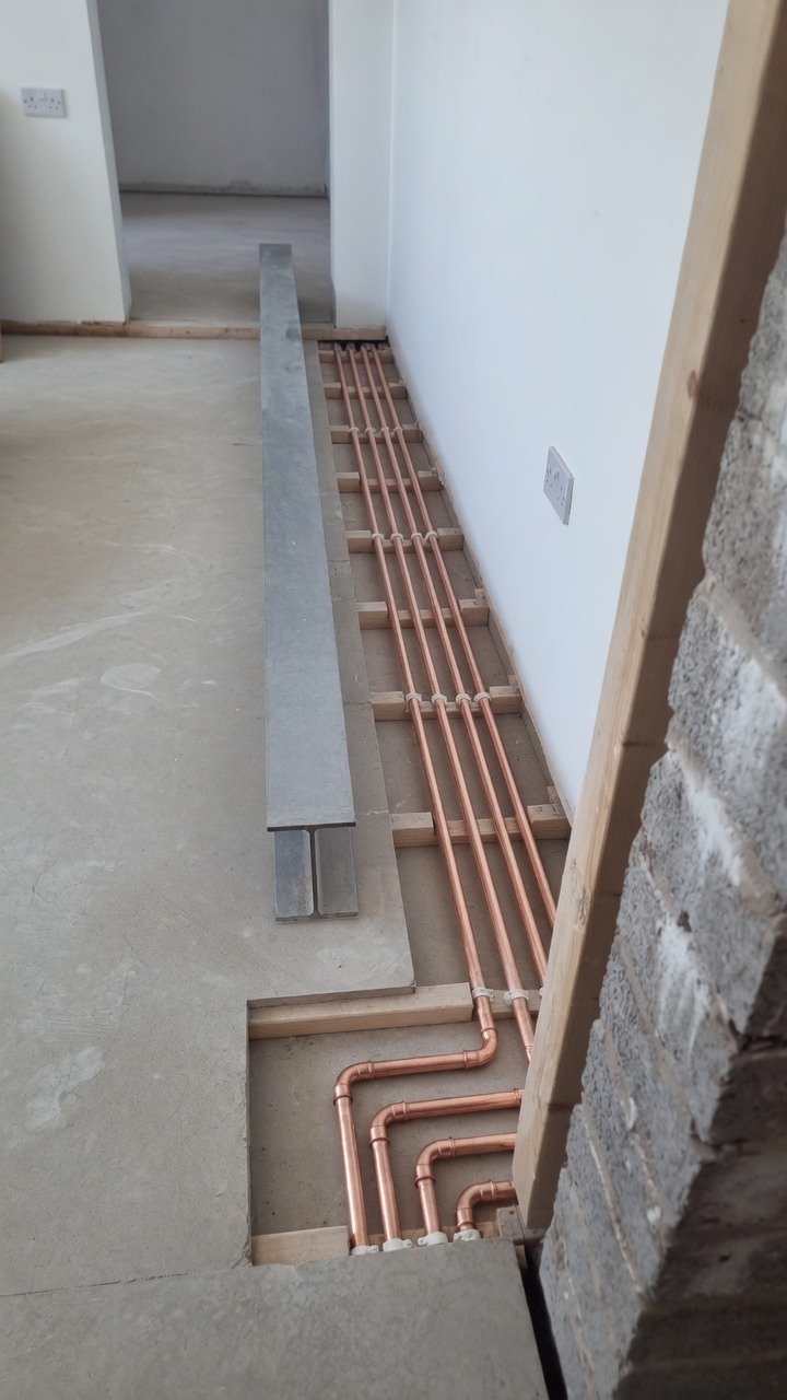 Clean underfloor copper pipe runs first fix