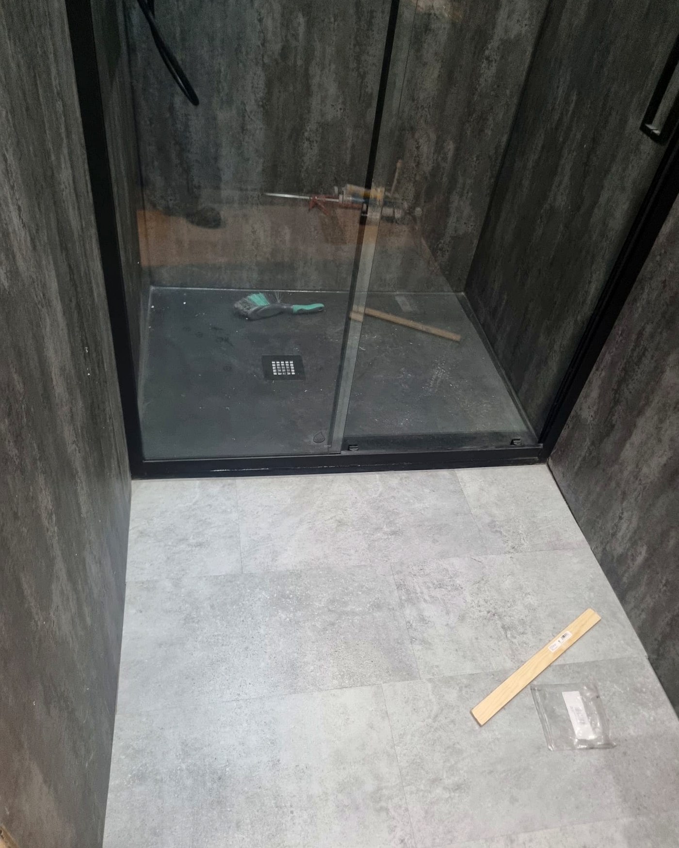 New shower tray and floor tiling detail